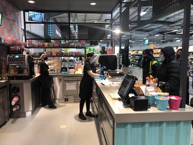 Dawnvale Group Staff serving customers at a supermarket